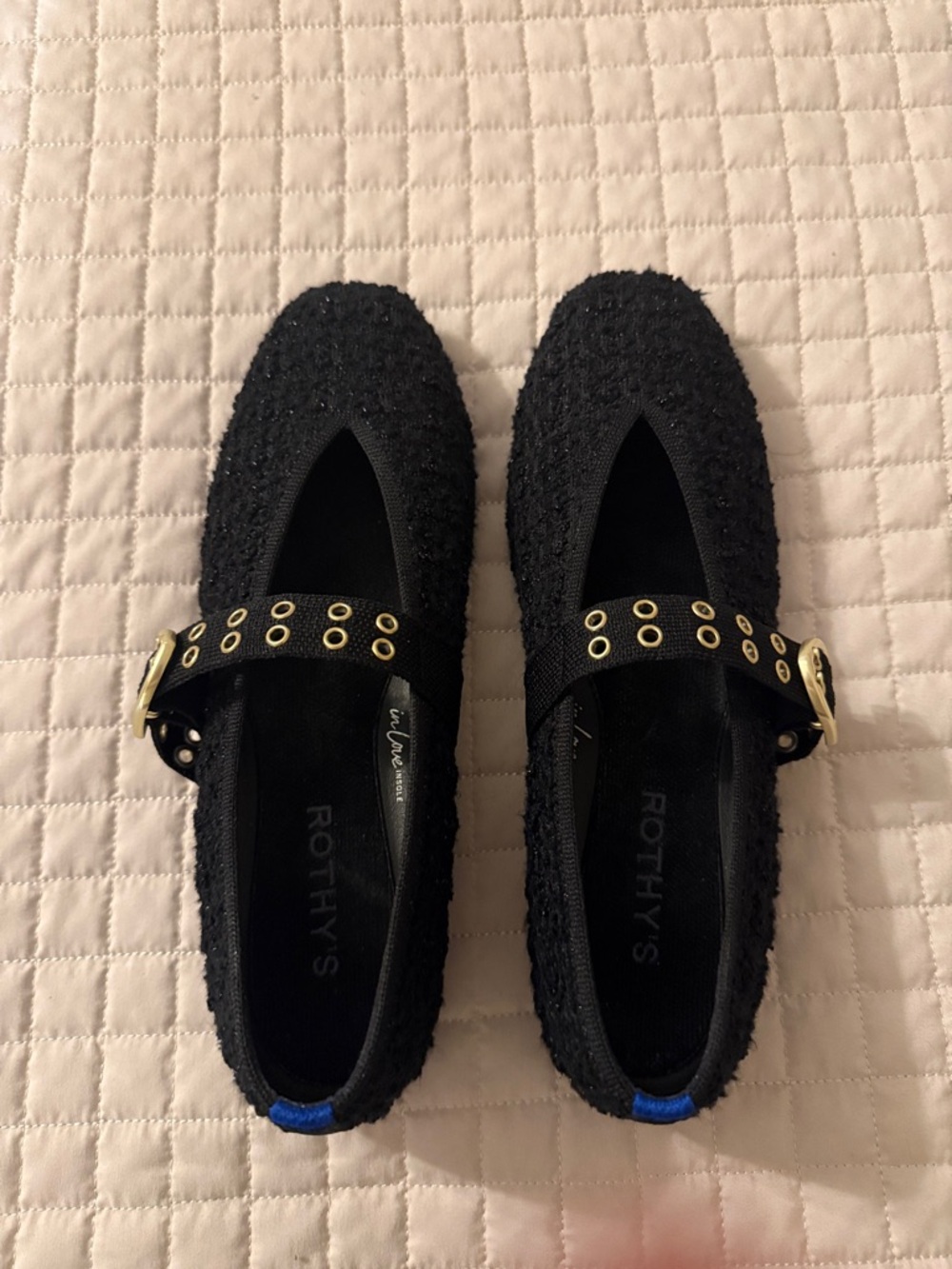 Rothy's Black Mary Jane Flats with Gold Eyelet Strap and Blue Heel Tab